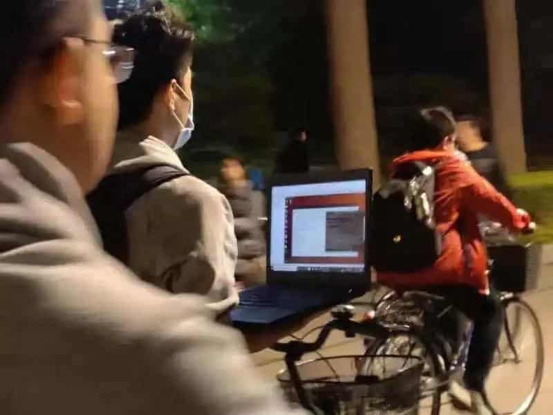 Video of Chinese student running program on laptop while riding bike goes viral